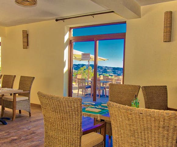 Inside dining area looking out at view of mountains at Gondar Hills Resort