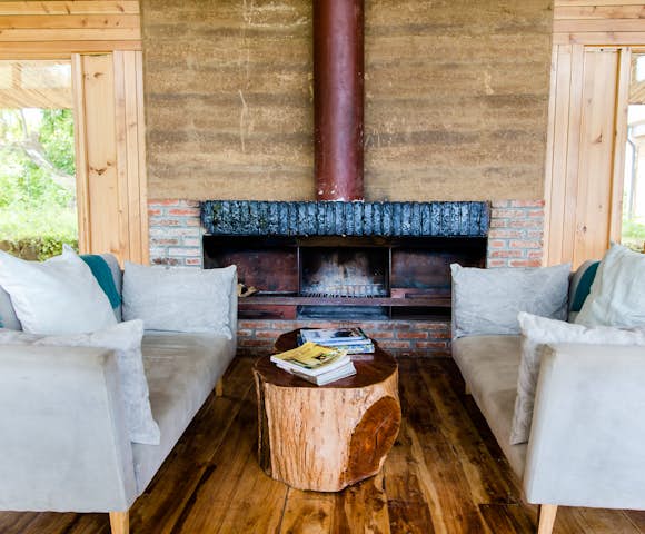 Sofas and fireplace at Limalimo Lodge in Simien Mountains