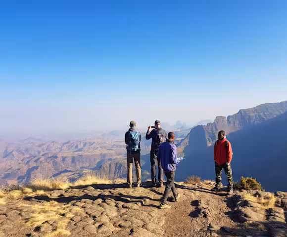 People looking at views in the Simien Mountains with blue skies
